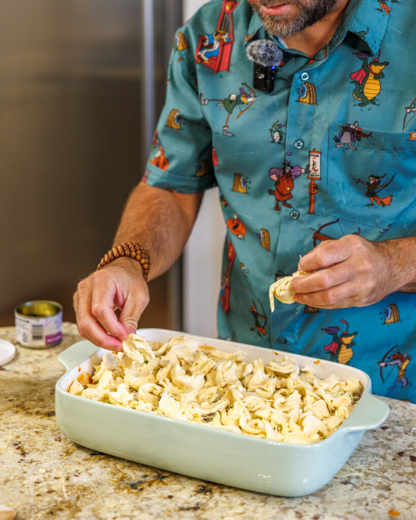 Matthew Bounds, creator of Your Barefoot Neighbor, adds ingredients to his Pizza Bubble Bake dish