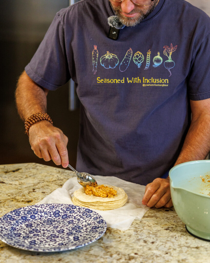 Matthew Bounds, creator of Your Barefoot Neighbor, adds ingredients to tortillas for his Shortcut Air Fryer Taquitos
