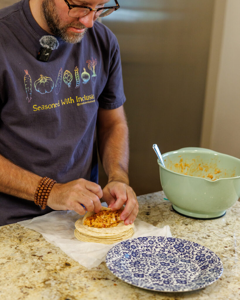 Matthew Bounds, creator of Your Barefoot Neighbor, adds ingredients to tortillas for his Shortcut Air Fryer Taquitos