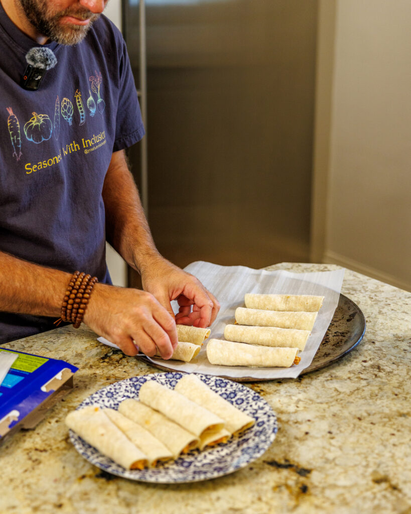 Matthew Bounds, creator of Your Barefoot Neighbor, rolls the taquitos for his Shortcut Air Fryer Taquitos