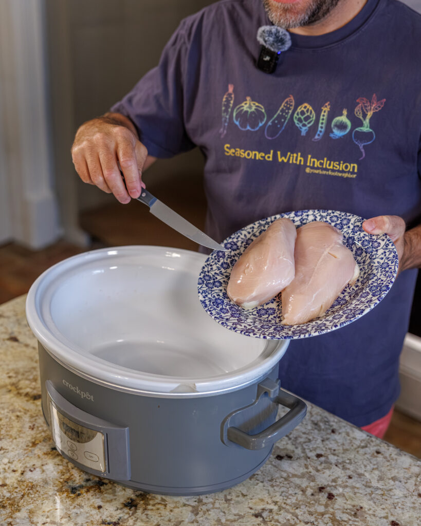 Matthew Bounds, creator of Your Barefoot Neighbor, prepares chicken for the slow cooker for his Slow Cooker Chicken & Gravy