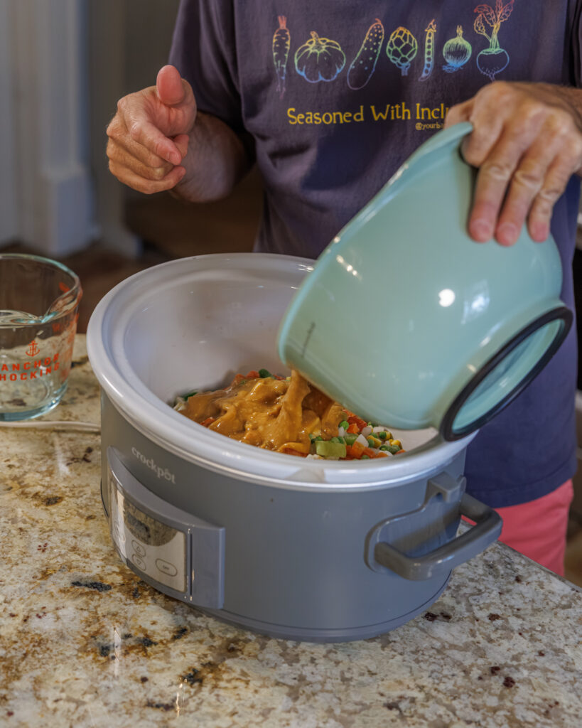 Matthew Bounds, creator of Your Barefoot Neighbor, prepares ingredients for his Slow Cooker Chicken & Gravy