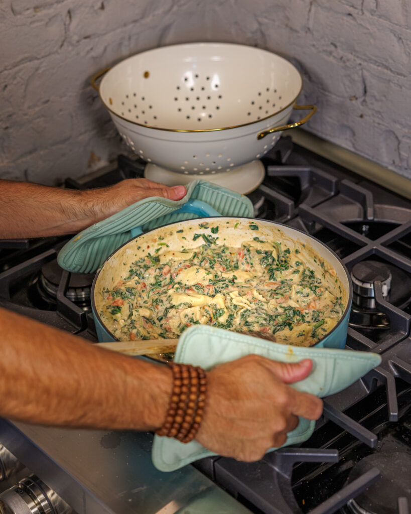 Matthew Bounds, creator of Your Barefoot Neighbor, holds a pot of his Back to School Too Tired Tortellini