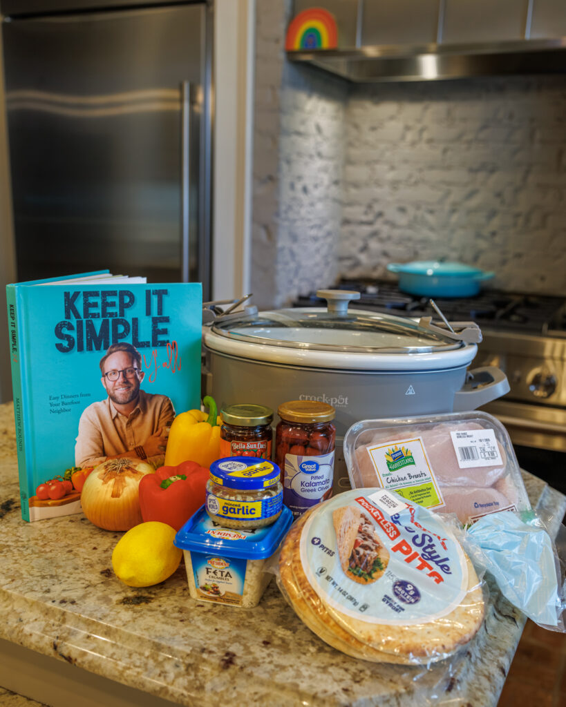 The ingredients for Chicken Pita Wraps from Keep It Simple Y'all, written by Your Barefoot Neighbor Matthew Bounds, sits on the kitchen counter next to Keep It Simple Y'all.