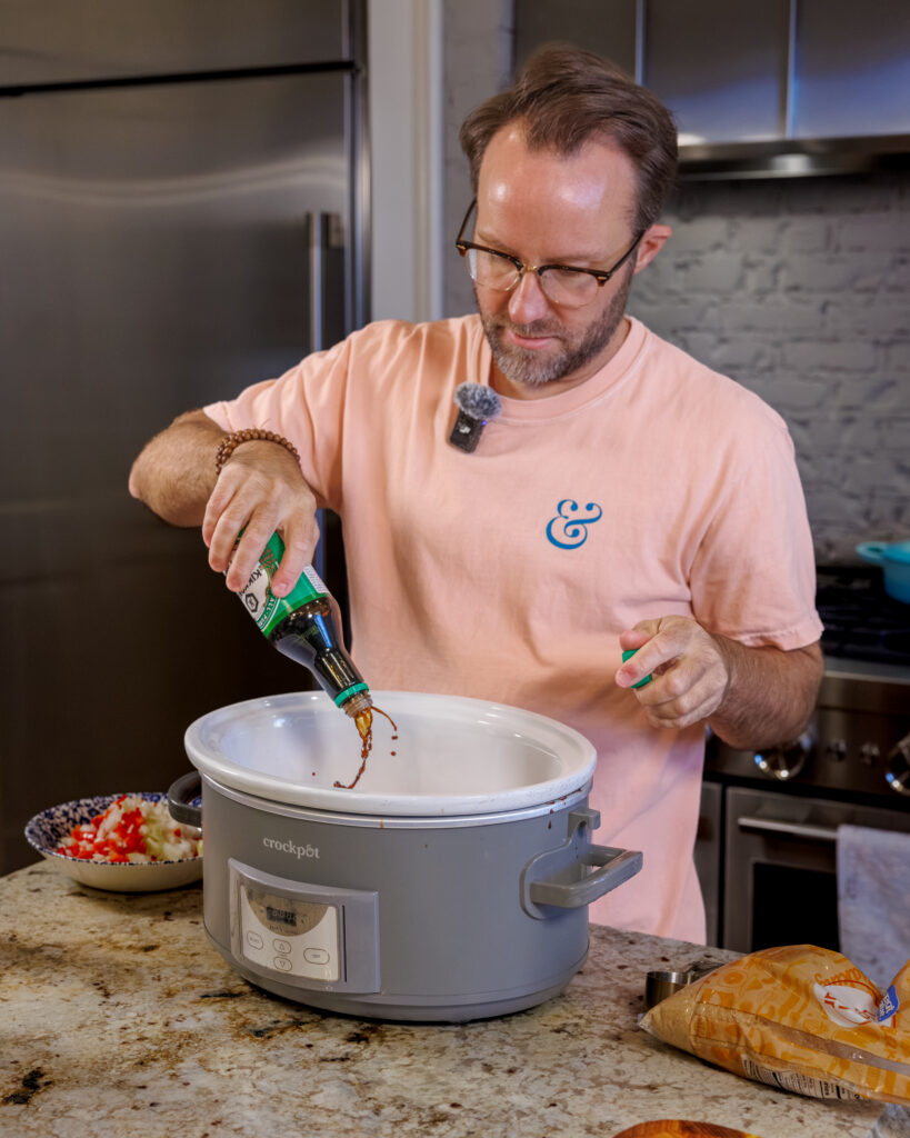 Matthew Bounds, creator of Your Barefoot Neighbor, adds ingredients to the Crockpot for his Keep it Simple Y'all Hawaiian Pork recipe