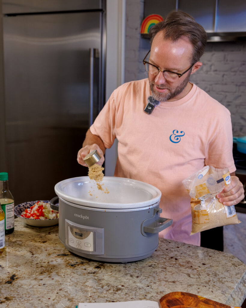 Matthew Bounds, creator of Your Barefoot Neighbor, adds ingredients to the Crockpot for his Keep it Simple Y'all Hawaiian Pork recipe