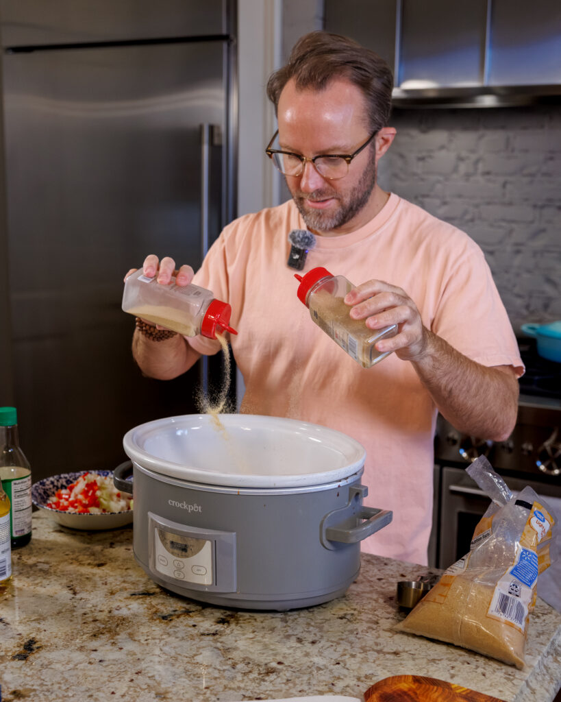 Matthew Bounds, creator of Your Barefoot Neighbor, adds ingredients to the Crockpot for his Keep it Simple Y'all showing Hawaiian Pork Crockpot recipe