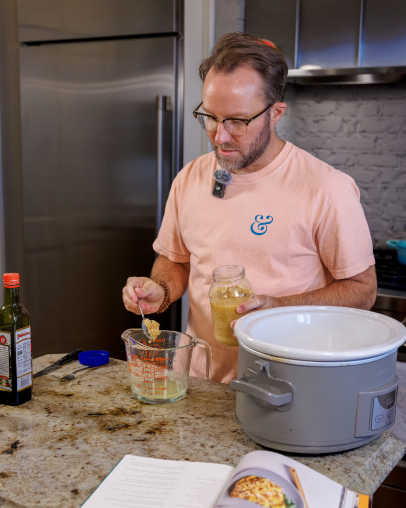 Matthew Bounds, creator of Your Barefoot Neighbor, adds ingredients to the Crockpot for his Lemon Sun Dried Tomato Chicken